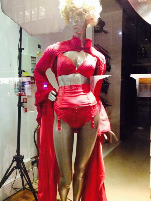 Window display at Rigby & Peller, holder of the Royal Warrant. I wonder if the Queen wears this?